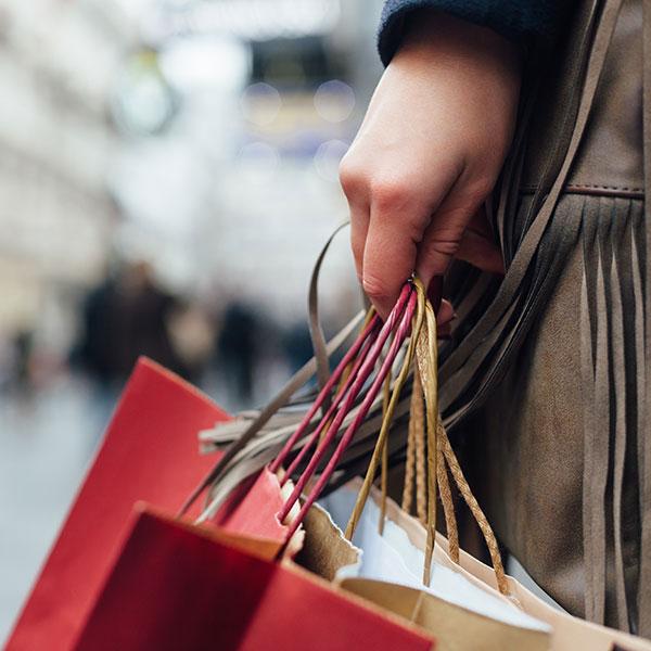 Person carrying shopping bags